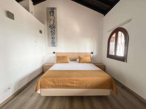 Llit o llits en una habitació de Alojamento Local Monte Horeb