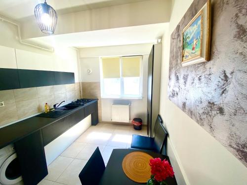 a small kitchen with a sink and a counter at Dolce Aqua Summerland Apartments in Mamaia