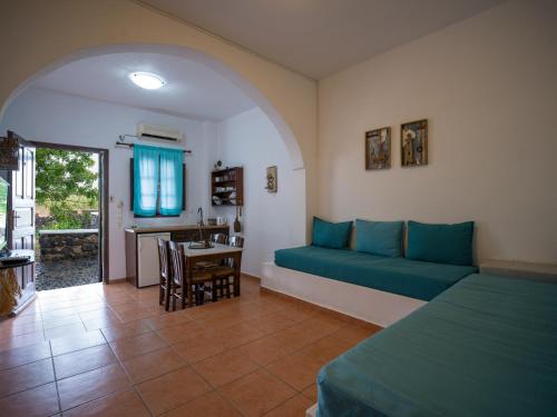 a living room with a couch and a table at Anna Traditional Apartments in Kamari