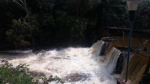 a waterfall with white water in a river at quartos suítes em Brotas in Brotas