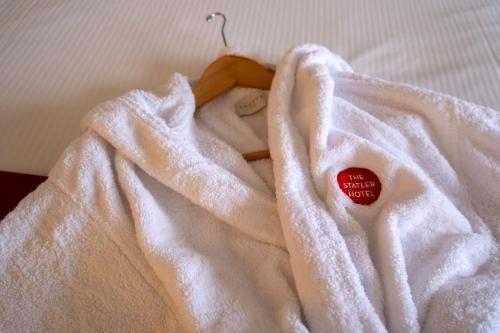a white blanket with a red sticker on it at The Statler Hotel at Cornell University in Ithaca