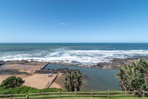 a view of the beach and the ocean at Chakas Cove 34 in Ballito