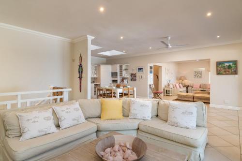 a living room with a couch and a dining room at Colwyn Drive 53 in Sheffield Beach
