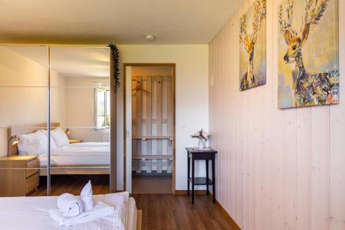 a bedroom with a bed and a mirror at Luna in Thun