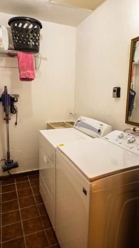 a kitchen with a white counter and a sink at Private Villa in Guadalajara with heated Swimming Pool in San Agustín