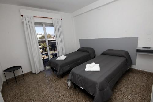 En eller flere senge i et værelse på Hotel Picasso