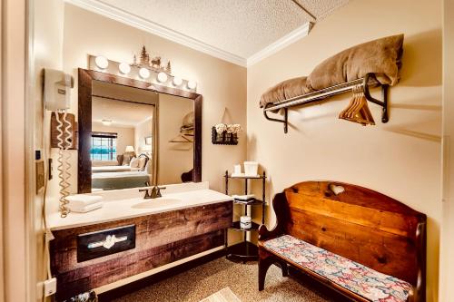 a bathroom with a sink and a mirror at Deerfield Inn - Virtual Check In in Hayesville