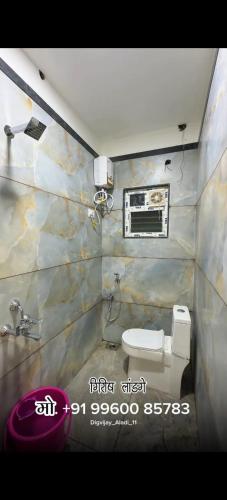 a bathroom with a sink and a toilet at Sai Samarth Residency Akkalkot in Akalkot