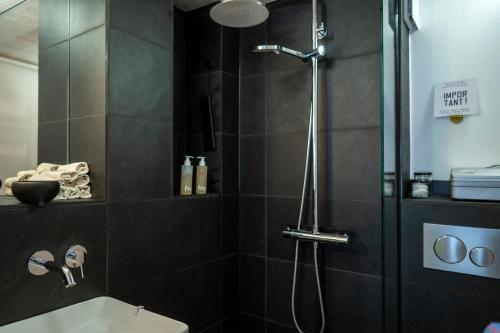 a bathroom with a shower with a toilet and a sink at zons22 Tiny Loft in Historic Zons - between Cologne & Düsseldorf in Dormagen