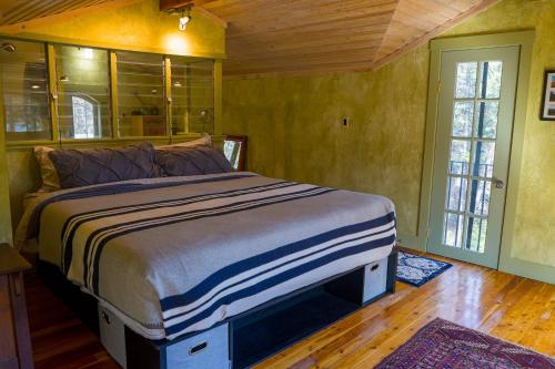 a bedroom with a large bed in a room at Off Grid Retreat Stay for 7 in Rexford