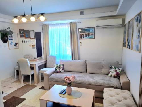 a living room with a couch and a table at Guesthouse Jelena in Višegrad