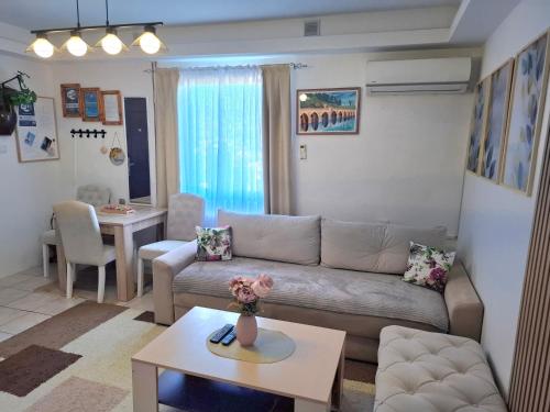 a living room with a couch and a table at Guesthouse Jelena in Višegrad