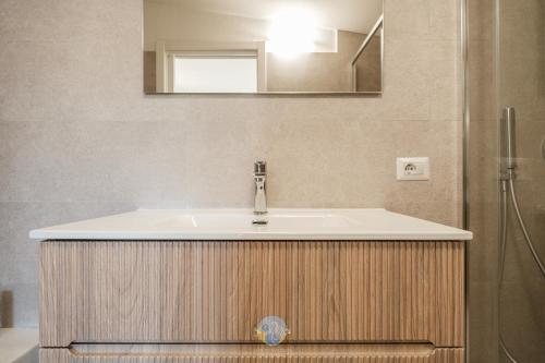 a bathroom with a sink and a shower at Villa Panorama Private Pool Costa Rei in Monte Nai