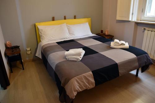 a bedroom with a bed with two towels on it at B&B Casale in Avellino