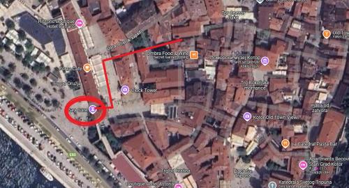 a map of a city with a red circle at Tetka Guest House in Kotor