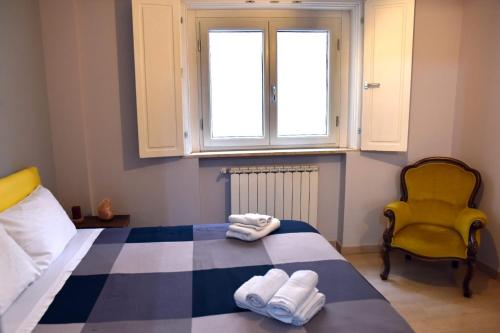 a bedroom with a bed with two towels on it at B&B Casale in Avellino