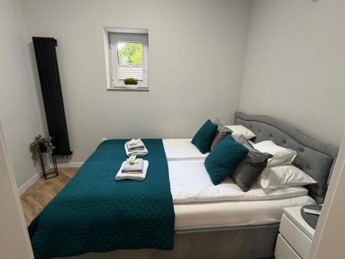 a bedroom with a bed with a tray on it at Apartamenty Sienkiewicza 41 in Kielce
