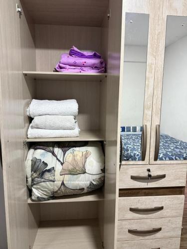 a bathroom with a sink and a mirror and towels at Comodidad en un solo lugar in Lima