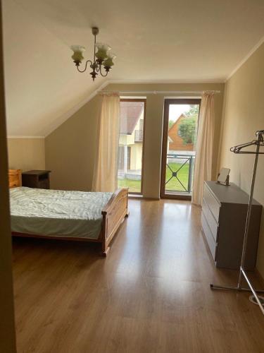 a bedroom with a bed and a dresser and a window at Ангеліна in Svityazʼ