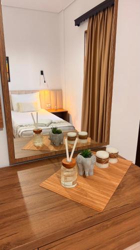 a bedroom with a bed and a large mirror at White house 2 Ksamil in Sarandë