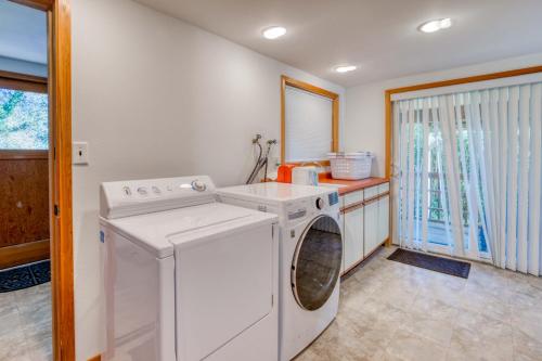 a white washer and dryer in a kitchen at Bamboo House - Meredith Lodging in Nehalem
