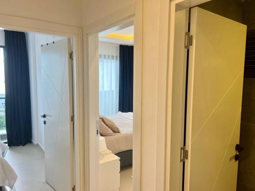 a bedroom with a mirror and a bed in a room at Salam Residence 2 - Ladies-Only Pool & Family Pools in Alanya