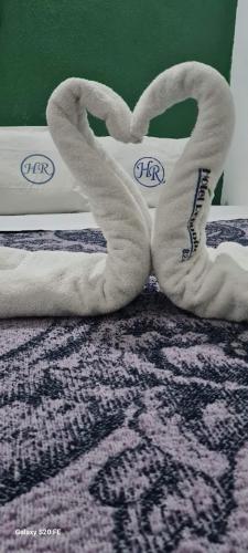 a pair of towels sitting on top of a bed at Hotel Republica in Mexico City