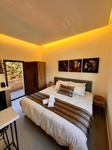 a bedroom with a large bed in a room at Railway Studio 1 - Cozy Studio in Byblos - Central Location in Jbeil