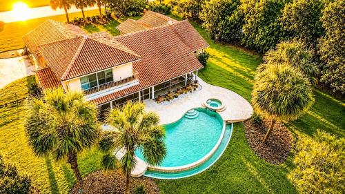 an aerial view of a house with a swimming pool at SWISS 41 - Golf Course in Clermont