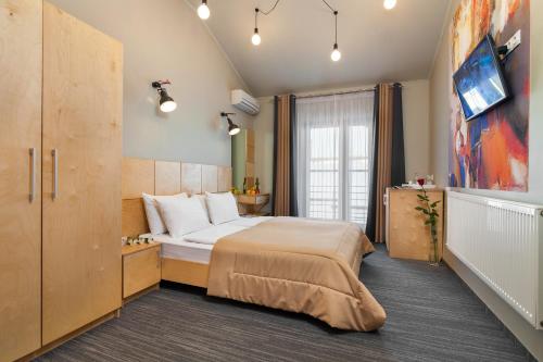 Una cama o camas en una habitación de Etude Hotel