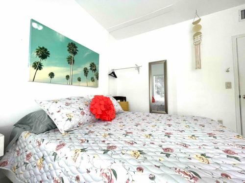 a bedroom with a bed with flowers on it at Stay Near Miami's Cultural Heart With Wifi in Miami