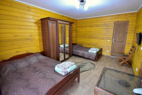 a room with two beds and a sink in it at Елізабет 1 in Svityazʼ
