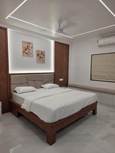 a bedroom with a large bed in a room at The Sanctuary by exot in Visakhapatnam