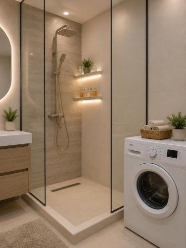 a bathroom with a washing machine and a washer at Vazi Aparthotel in Tbilisi City