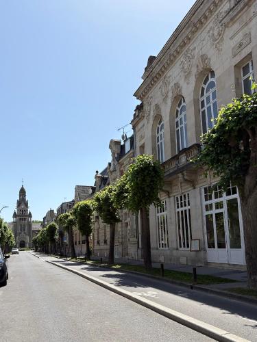 an empty street in front of a large building at Salon Boyer in Épernay