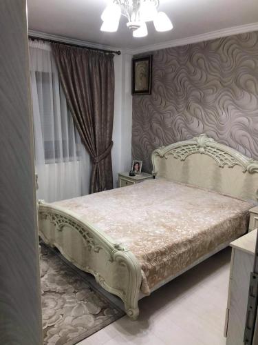 a bedroom with a large bed in a room at AmiraHome in Galaţi