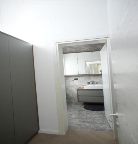 a bathroom with a sink and a mirror at Villa Krasta in Elbasan
