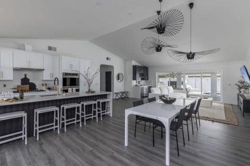 a kitchen and living room with a table and chairs at Old Town Fashion(ed)-Pool-Putting Green-BBQ Grill in Scottsdale
