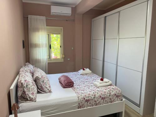 a bedroom with a bed with towels on it at Nesti house in Orikum