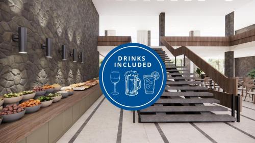 a drink introduced sign in a building with stairs at Alemaris Resort in Baška Voda