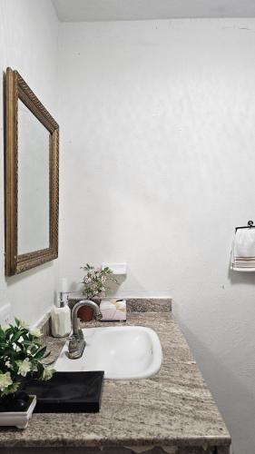 a bathroom counter with a sink and a mirror at Villa Privada 1200m2 Laguna a Pasos Pet Friendly in Xul-Ha