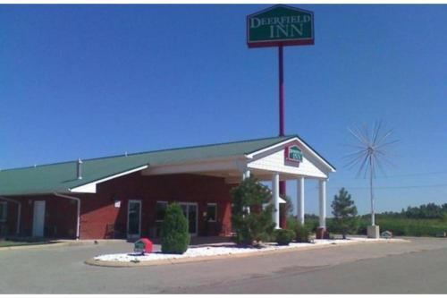 alderman inn with a sign on top of it at Deerfield Inn & Suites Steele Near Blytheville I-55 in Steele