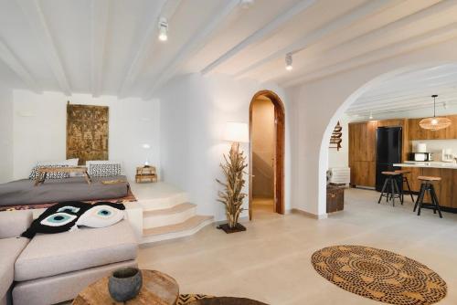 a living room with a bed and a couch at 5 SENSES in Pefki