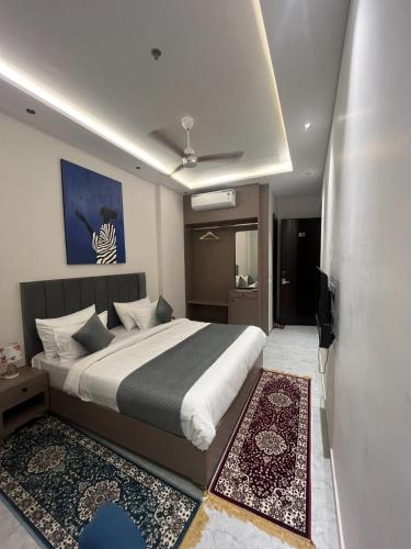 a bedroom with a large bed in a room at Hotel route 54 in Bathinda