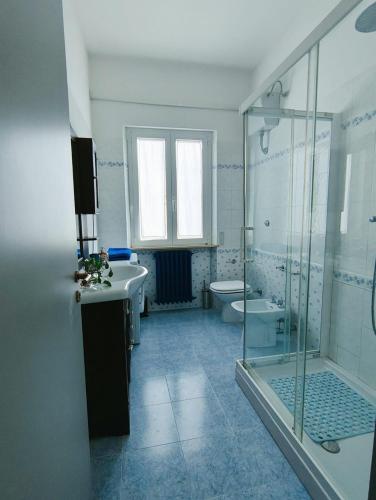 a bathroom with a shower and a sink and a toilet at Dimora al Civico 35 in Montefano