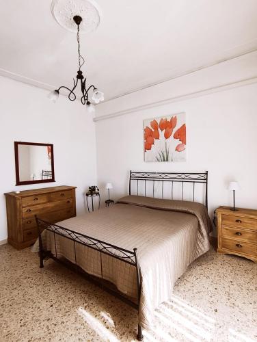 a bedroom with a bed and a television in it at Dimora al Civico 35 in Montefano