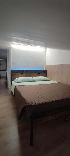 a bedroom with a bed with a light above it at Mazzmarill in Pizzoferrato