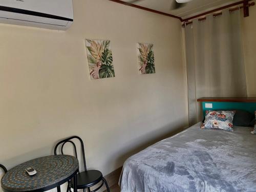 a bedroom with a bed and a table and chairs at Chill Studio Near Beach Tamarindo in Tamarindo
