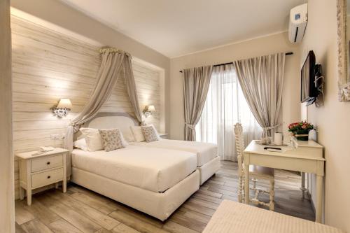 Postel nebo postele na pokoji v ubytování Casa Mia Vaticano Guest House