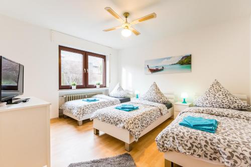 Ένα ή περισσότερα κρεβάτια σε δωμάτιο στο Apart2Stay Dormagen